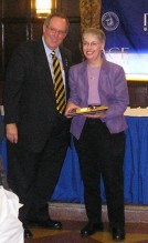 Marie Newman receiving her Outstanding Contribution Award from former Pace president David Caputo.