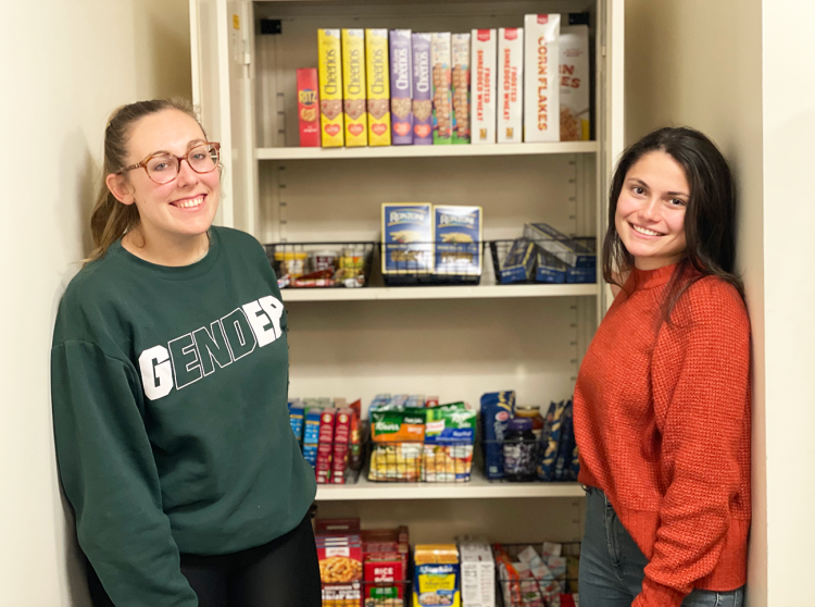 Members of the Student Bar Association show off the Haub Law Food Pantry